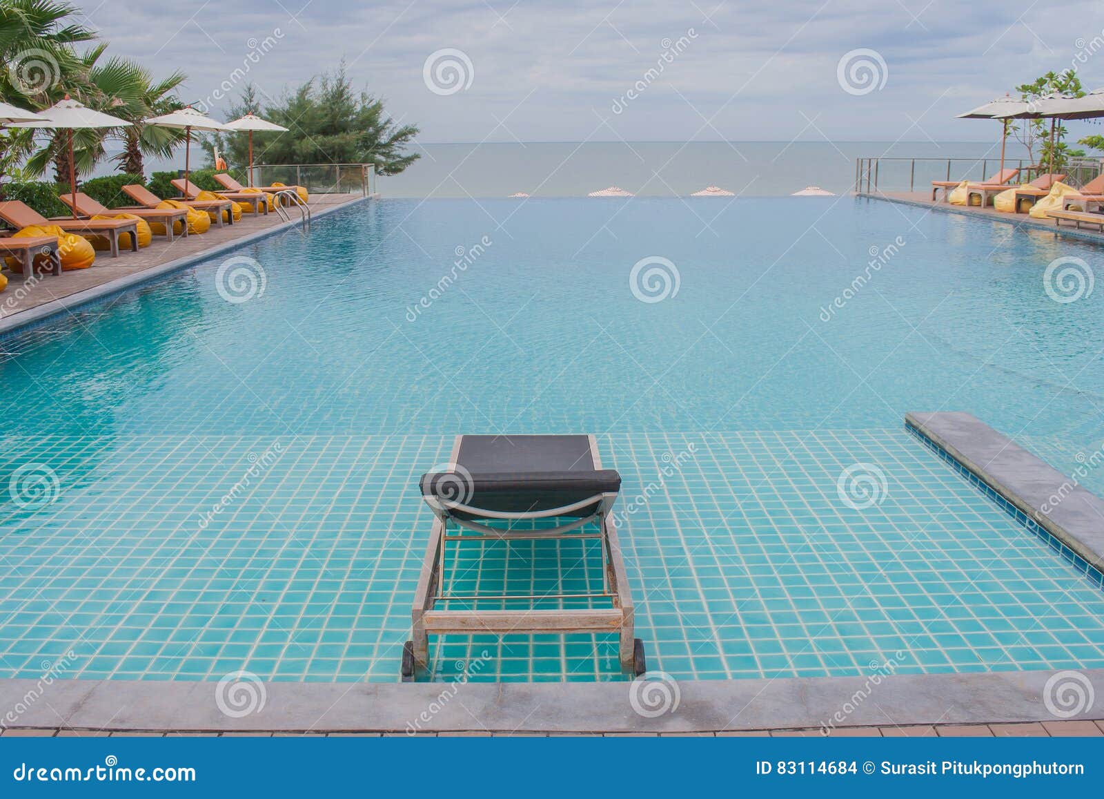 Daybed beside Swimming Pool. Stock Photo Image of nature, holiday
