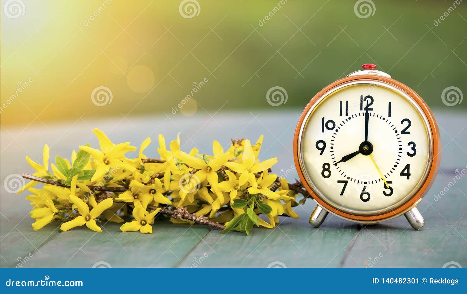 daylight savings time, spring forward - banner of an alarm clock and flowers