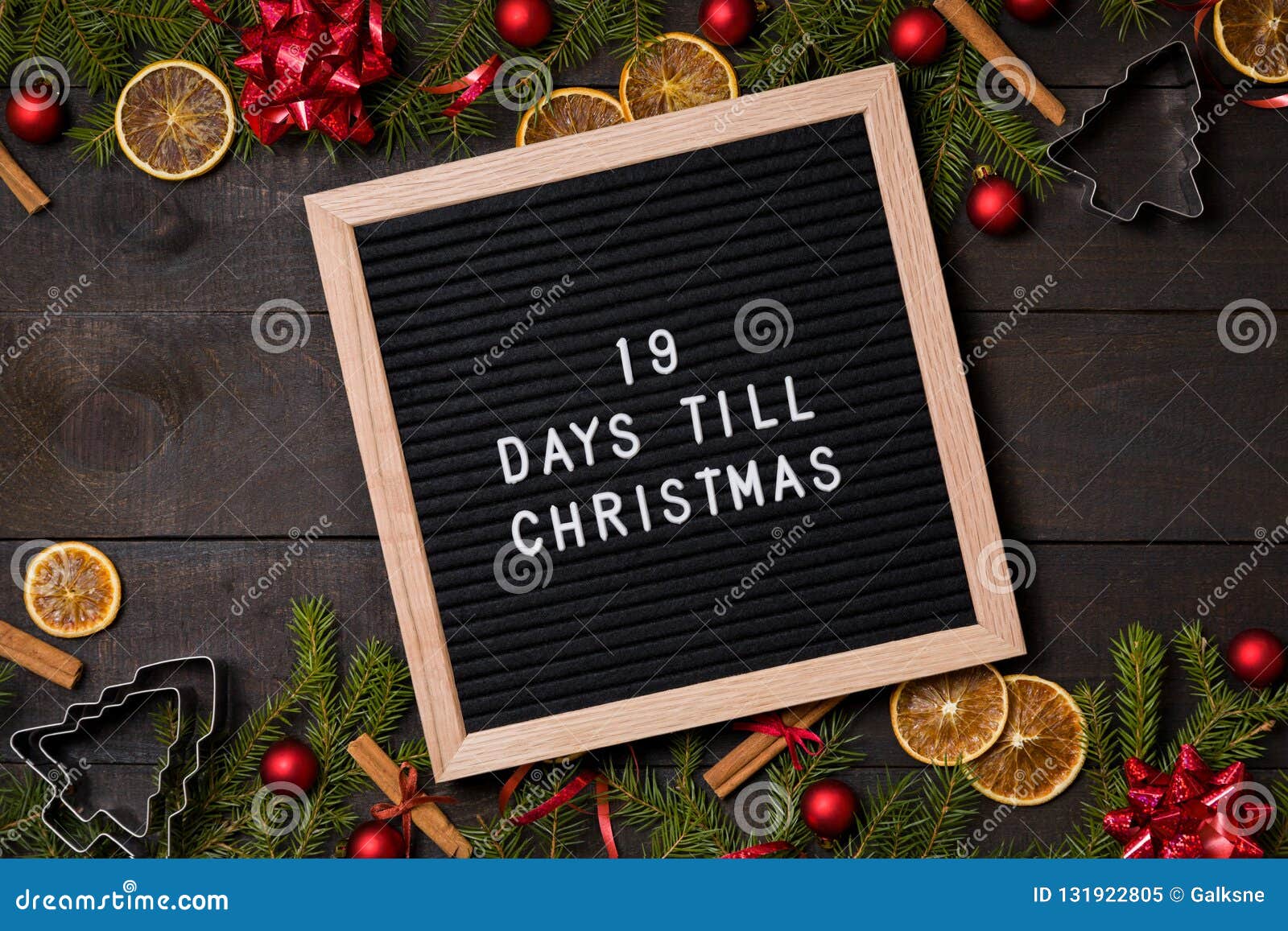 19 Days Till Christmas Countdown Letter Board on Dark Rustic Wood Stock