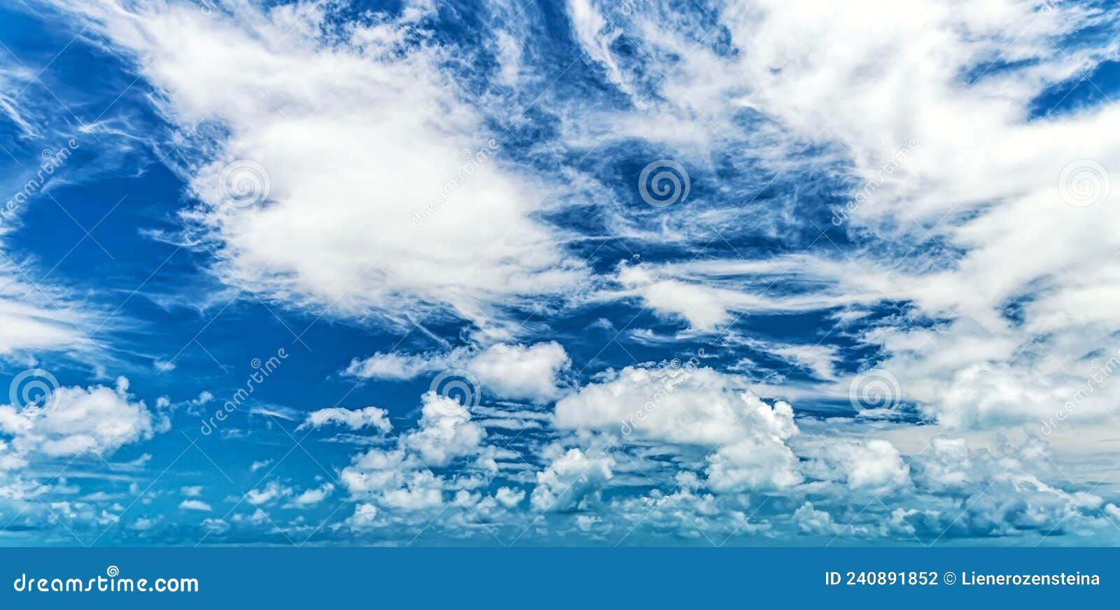 Blue sky background and white clouds soft focus, and copy space