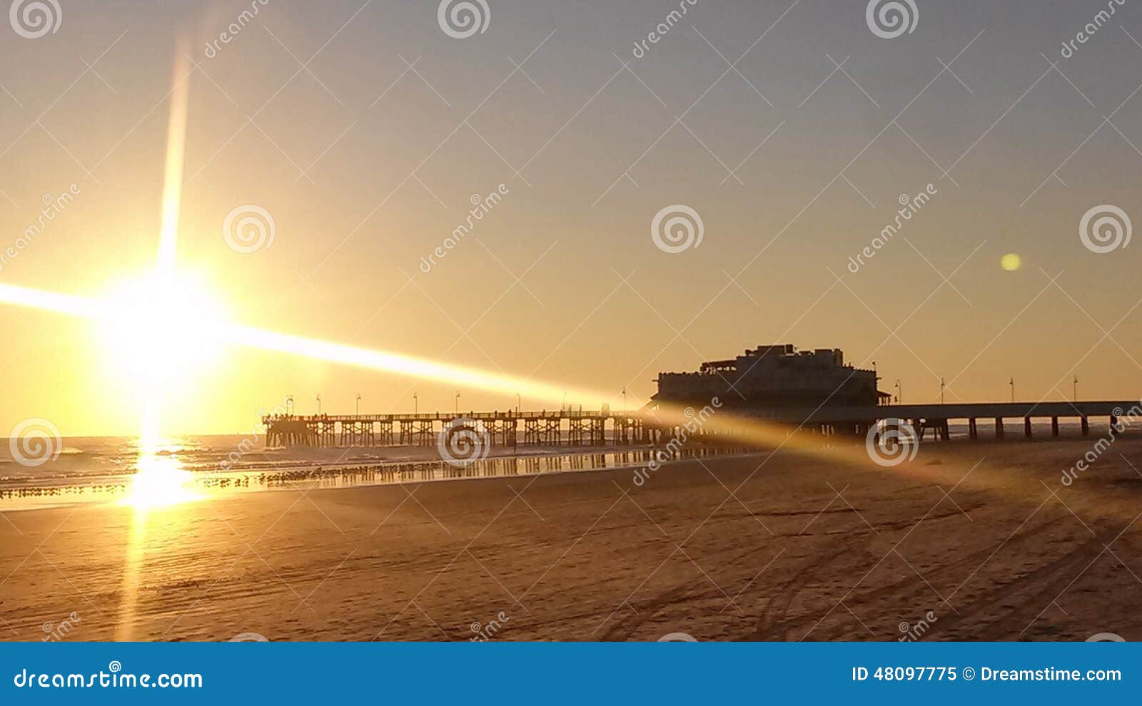 Daytona Beach Pier during sunrise. The sunrise in Daytona at the beach.
