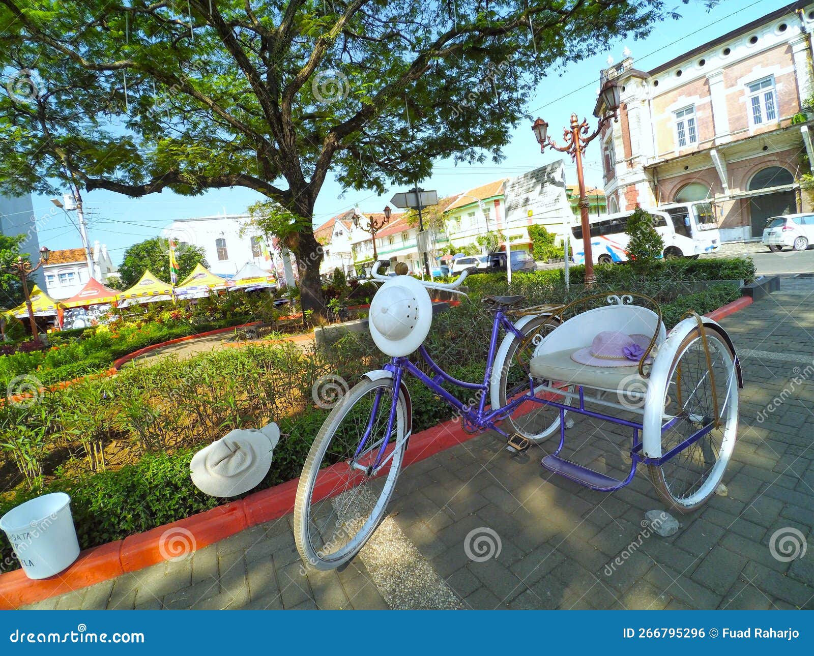 Colored Tricycle Parked in Road Stock Photo Image of wheel, tarmac