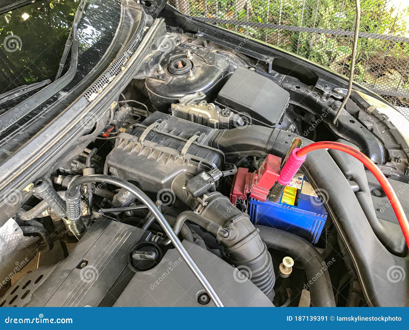 Dead Car Battery Jumping. Car Assistance by Battery Jumping Stock Image