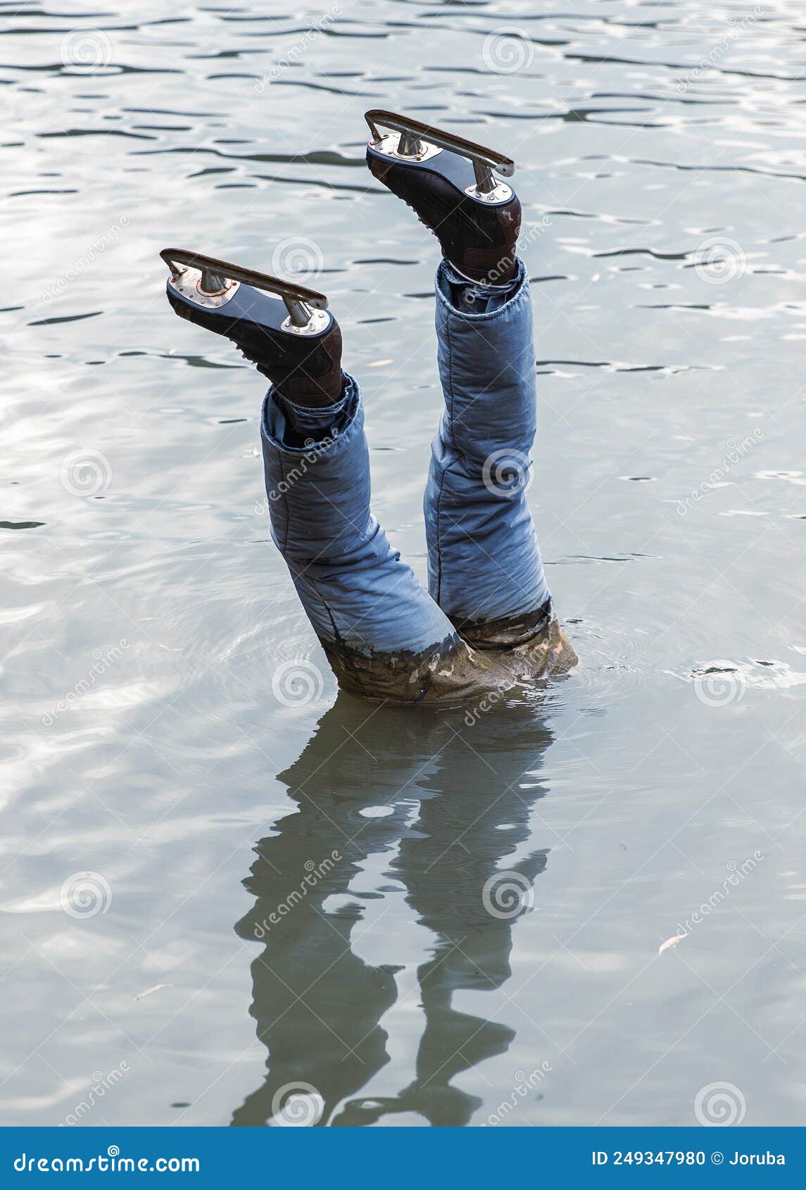 dead ice skater head downwards in water