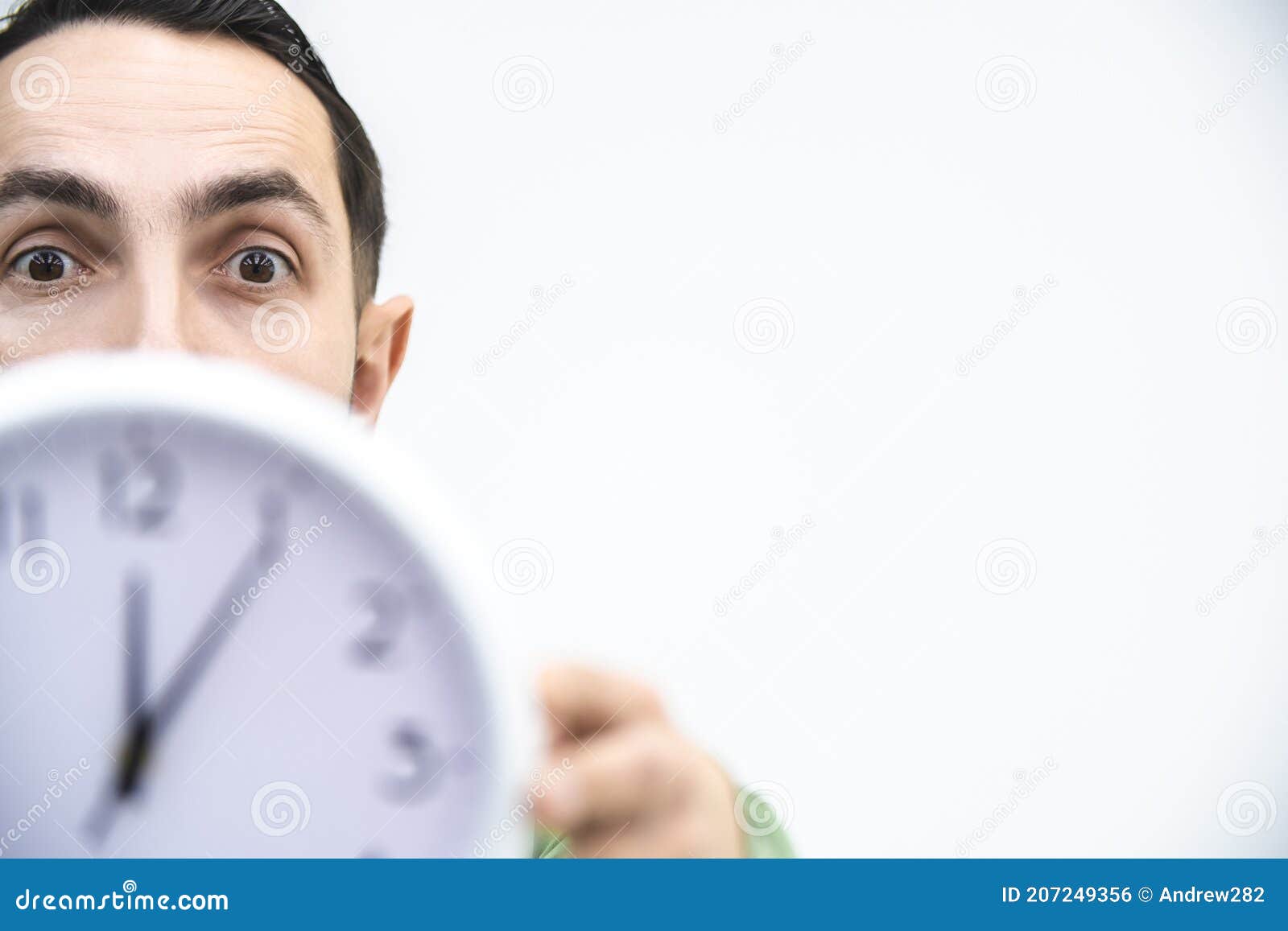 Businessman trying to stop time Stock Photo by ©kantver 69891211