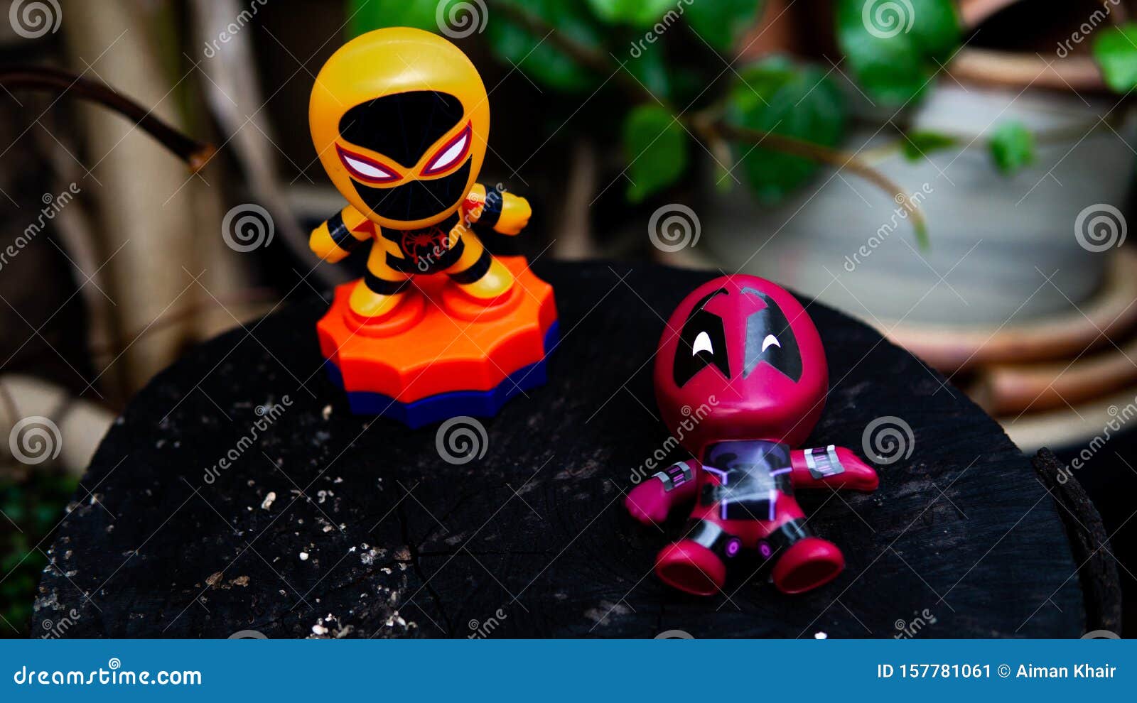 Two McDonald's Toy Deadpool And Orange Spiderman Having A Final Fight