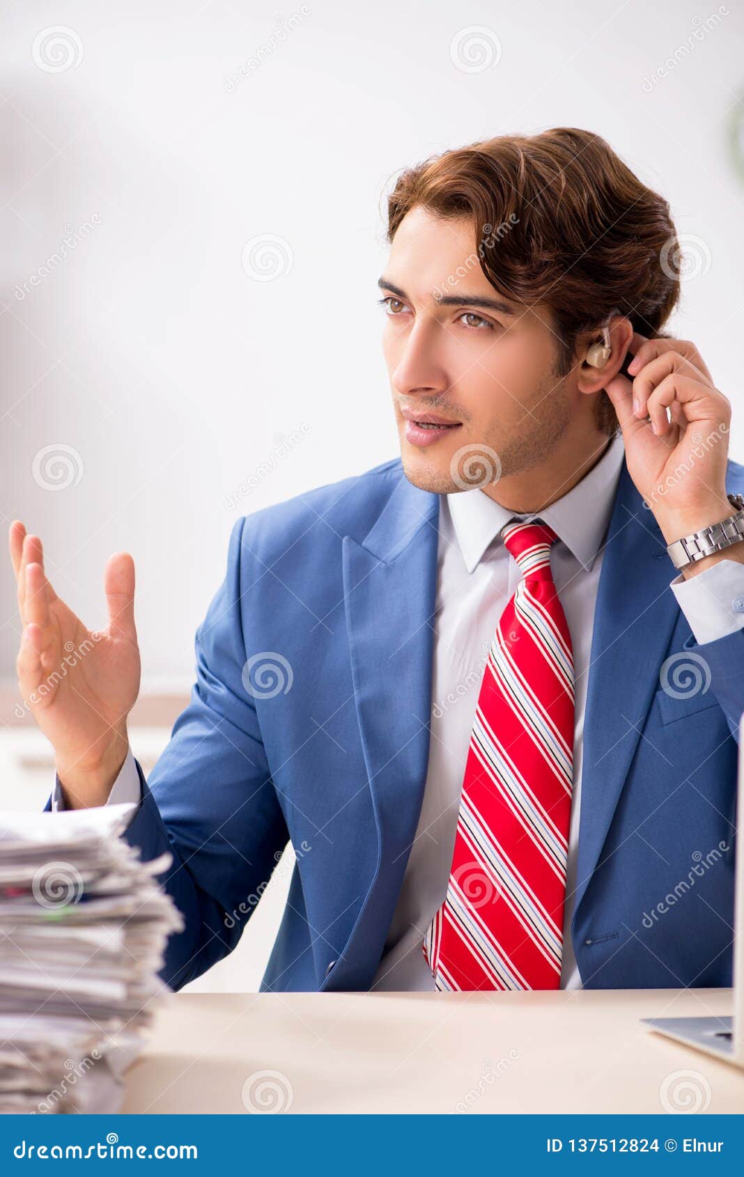 The Deaf Employee Using Hearing Aid in Office Stock Photo Image of