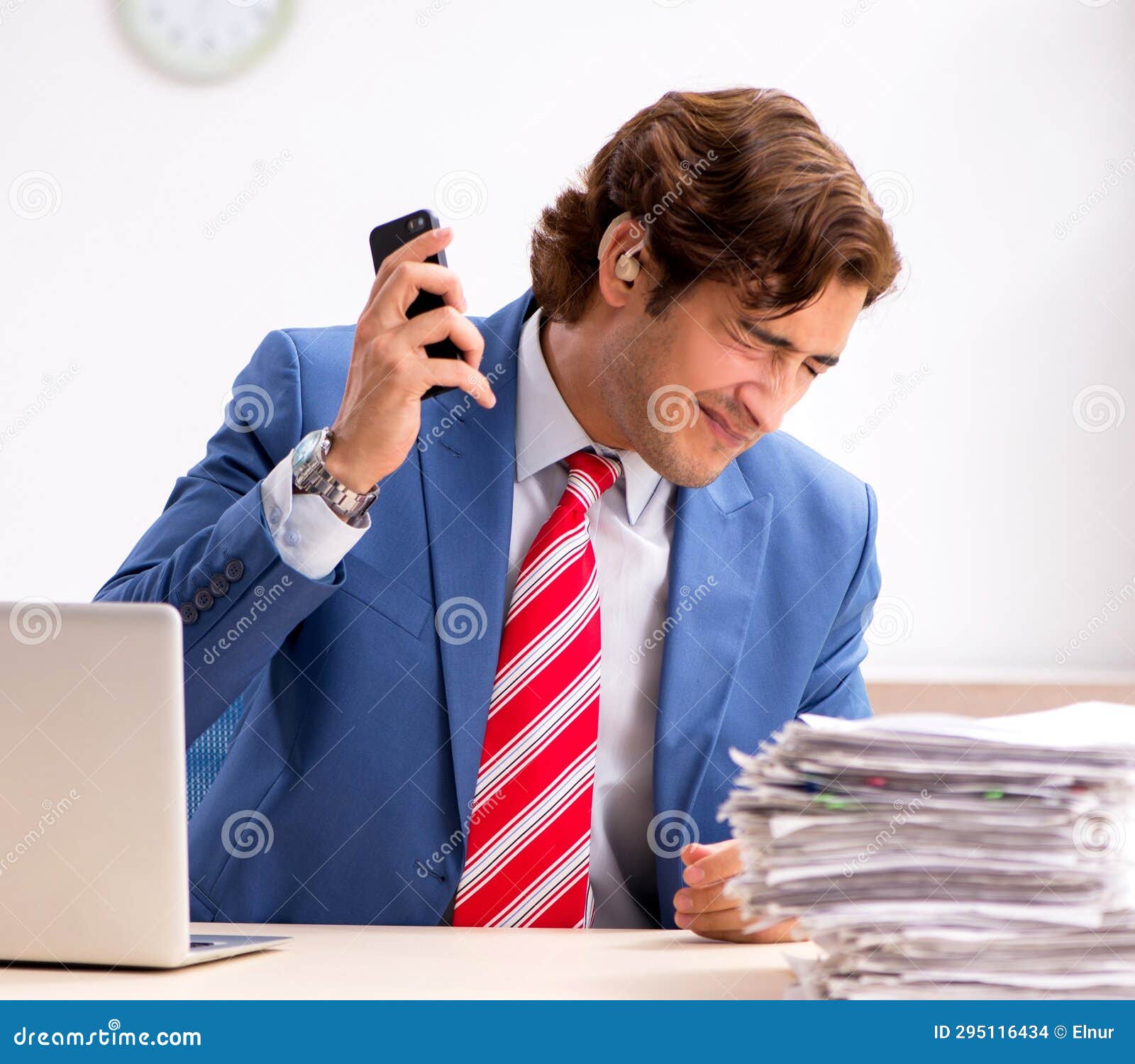 Deaf Employee Using Hearing Aid in Office Stock Photo Image of