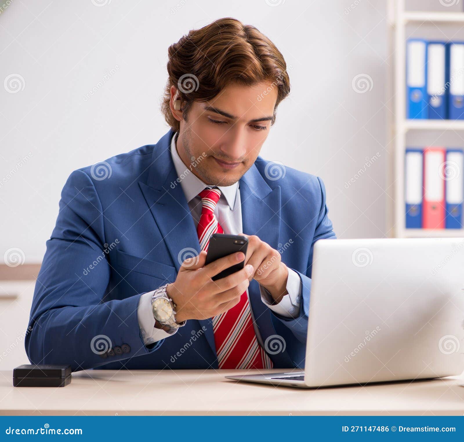 Deaf Employee Using Hearing Aid in Office Stock Photo Image of