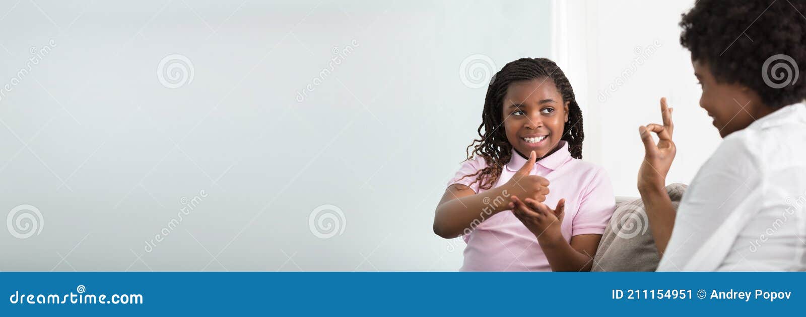 deaf mother talking sign language with her daughter