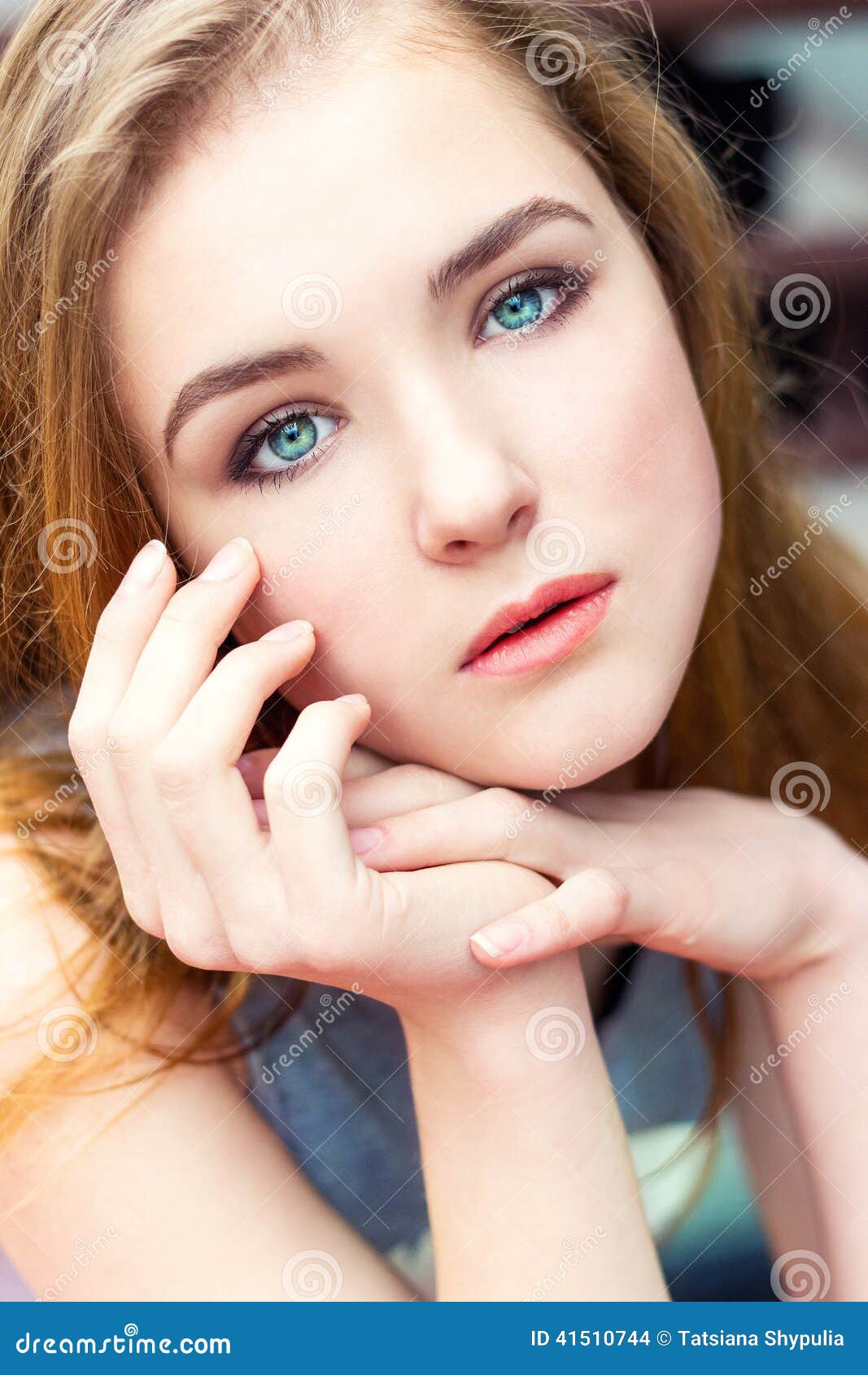 dear beautiful elegant young girl with blue eyes with regime hair seated