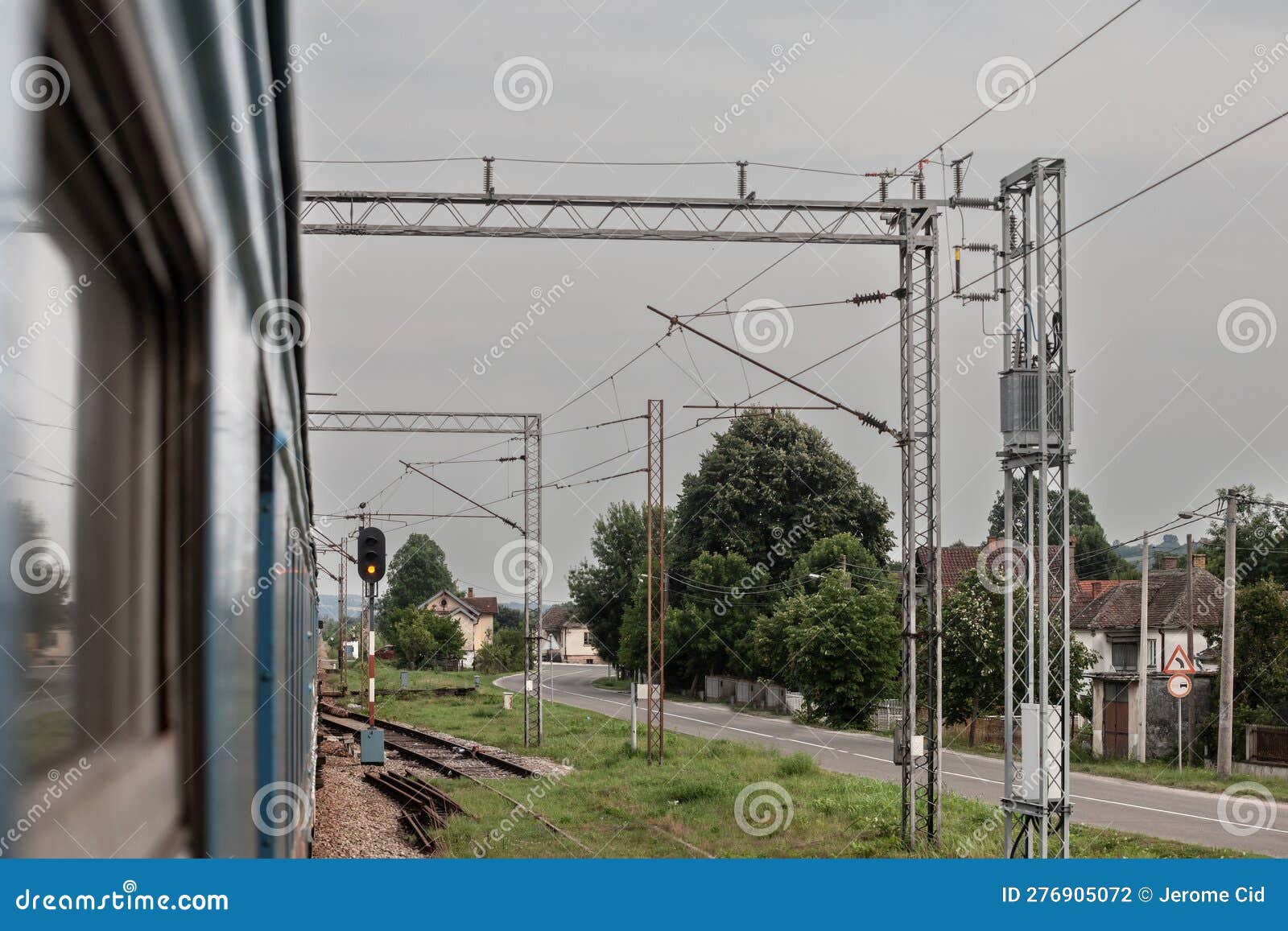 decaying railway infrastructure seen from the window of an electric suburban train, an emu of beovoz bg voz service on a train,