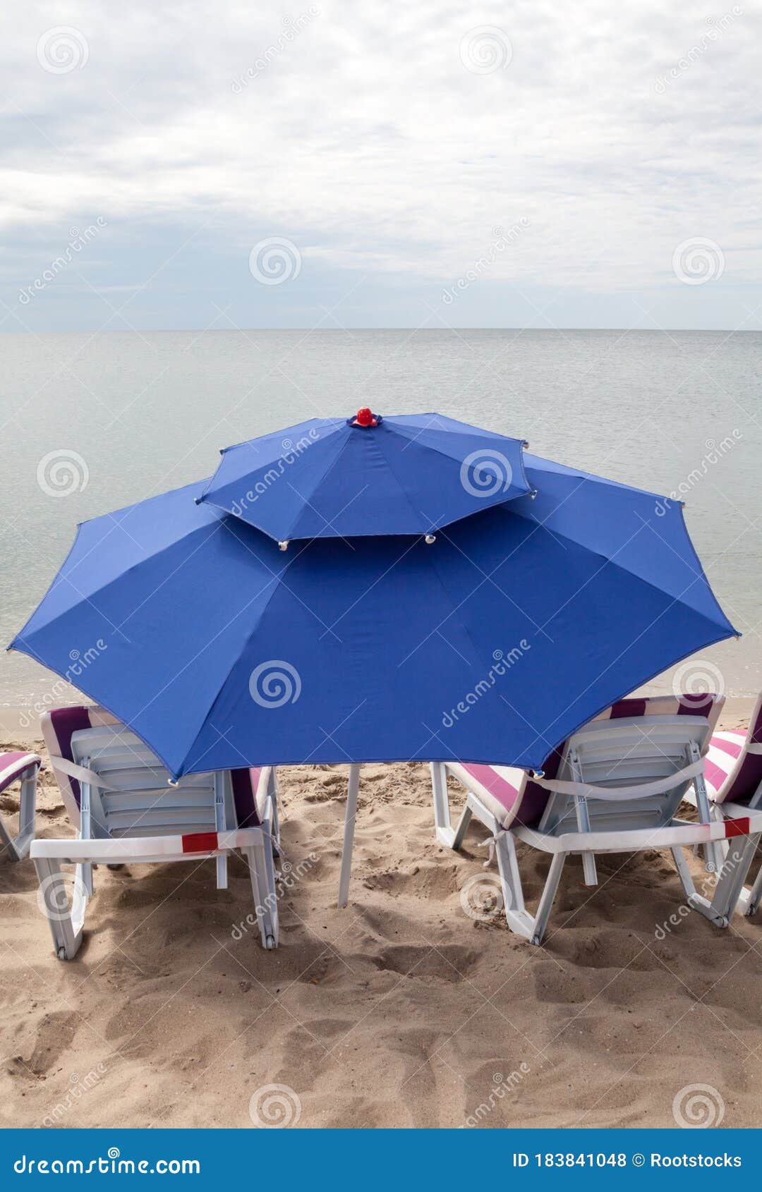 deck chairs and umbrella on the beach