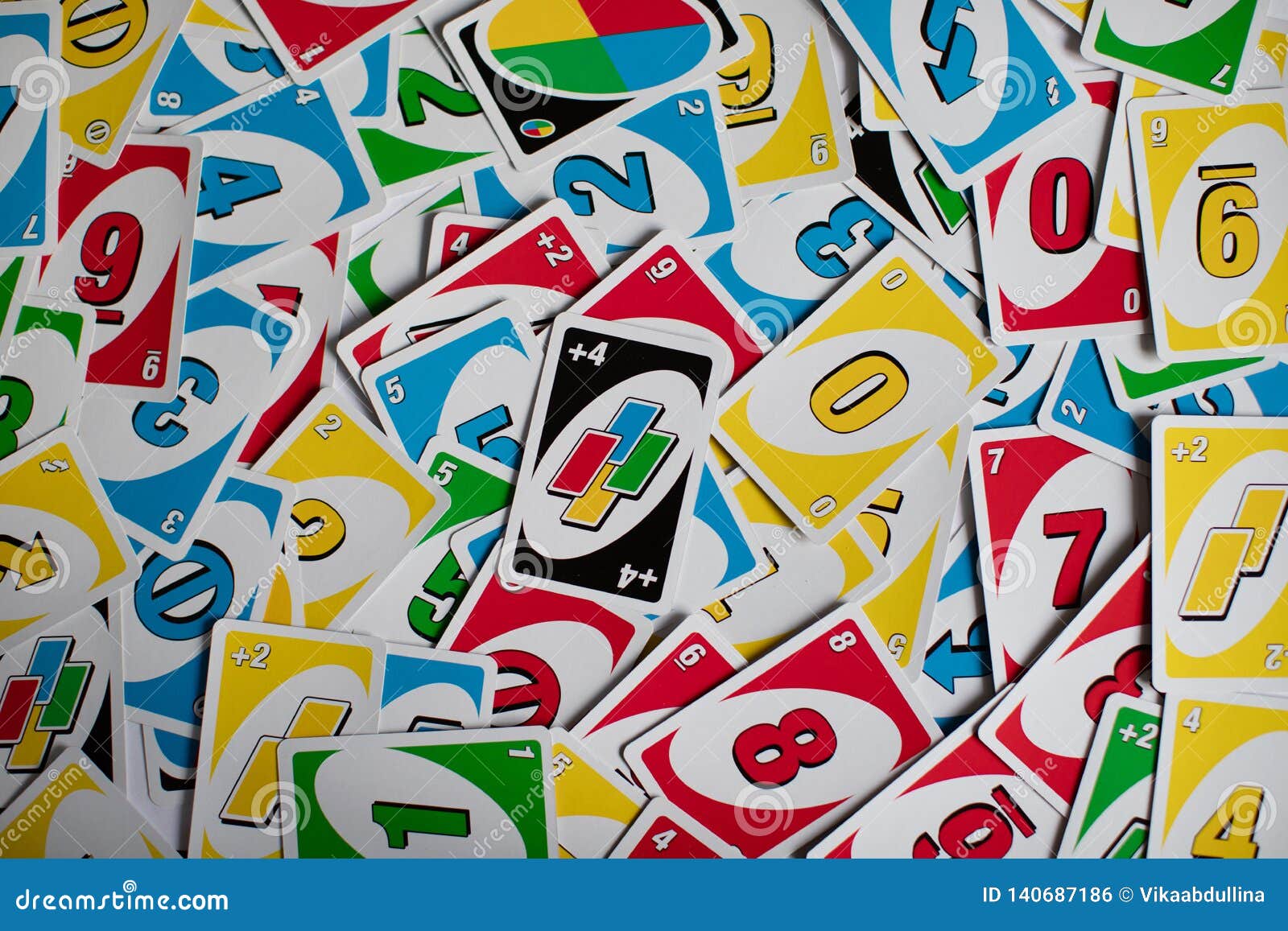 Deck of Uno Game Cards Scattered All Over on a Table. American