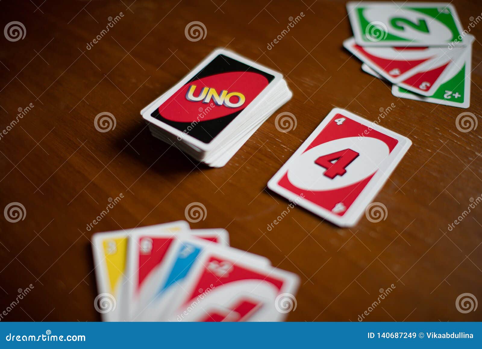 Deck of Uno Game Cards Scattered All Over on a Table. American