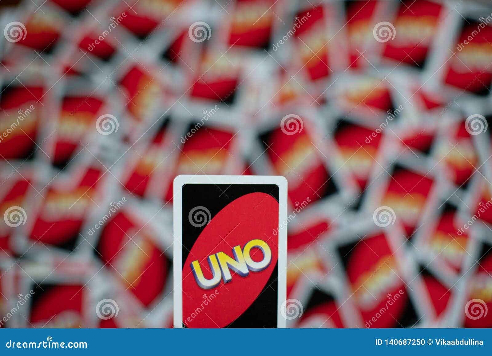 Deck of Uno Game Cards Scattered All Over on a Table. American