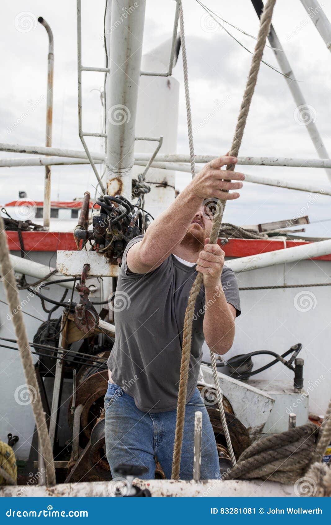 deckhand working on boat in south carolina stock image