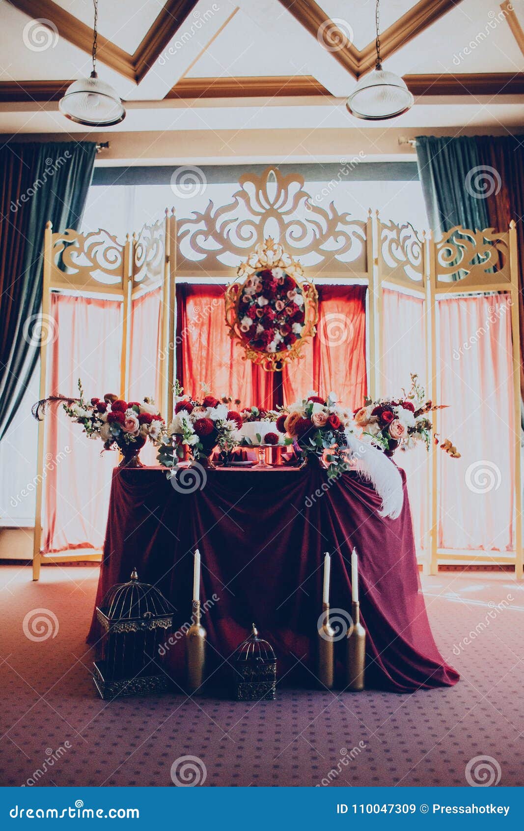 Decor of a Wedding Restaurant in Maroon Color with Flowers Stock