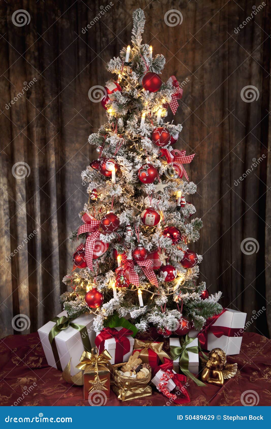 Decorated Christmas Tree with Electric Candles and Presents Stock Image
