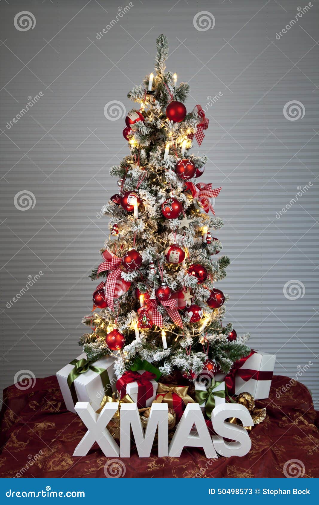 Decorated Christmas Tree with Electric Candles and Presents Stock Image