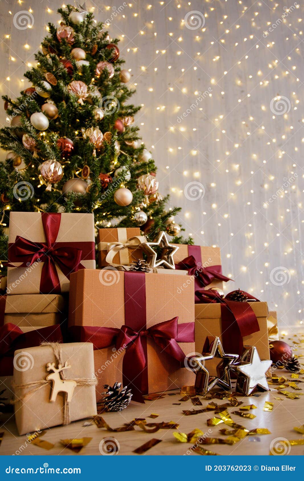 Decorated Christmas Tree and Gift Boxes with Stars and Confettti Stock