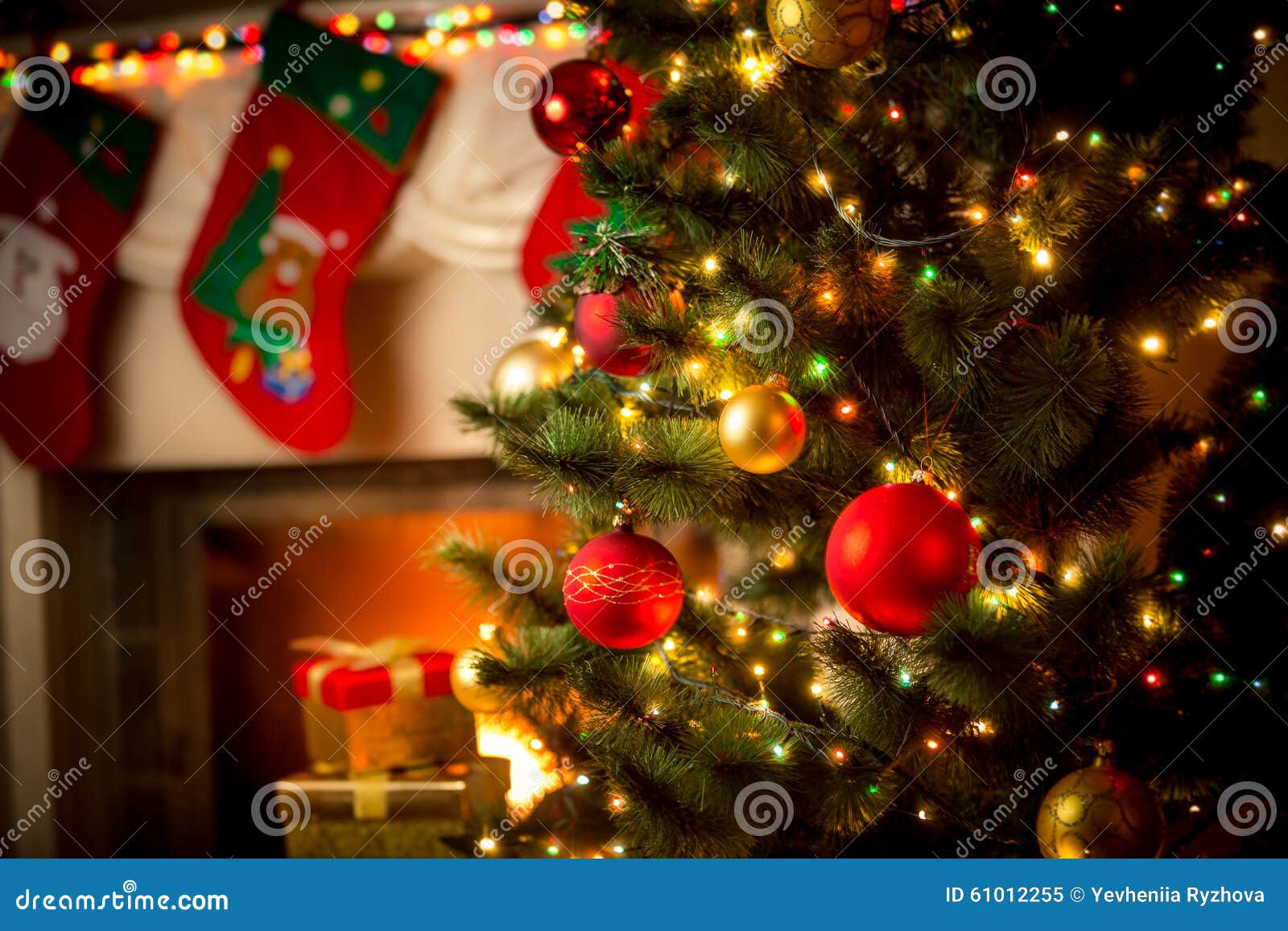 decorated fireplace and christmas tree at cottage