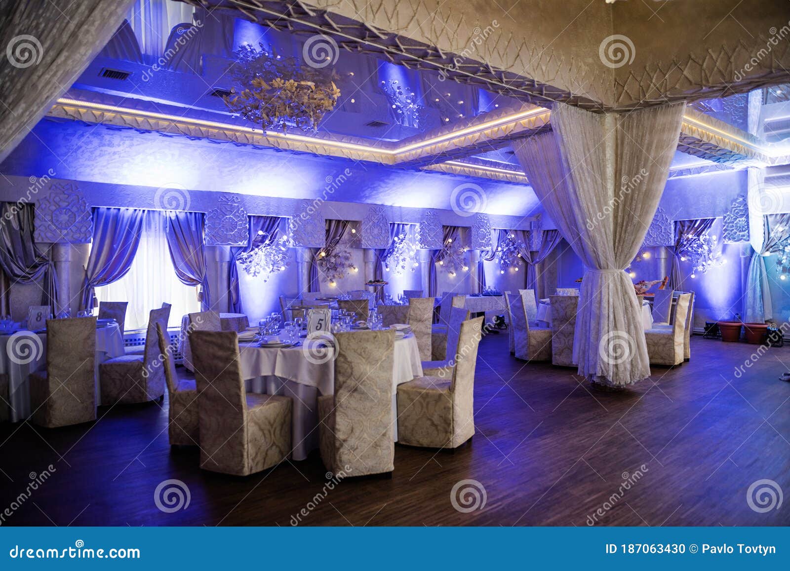 Decorated Wedding Hall with Dance Floor and Blue Light Stock Photo