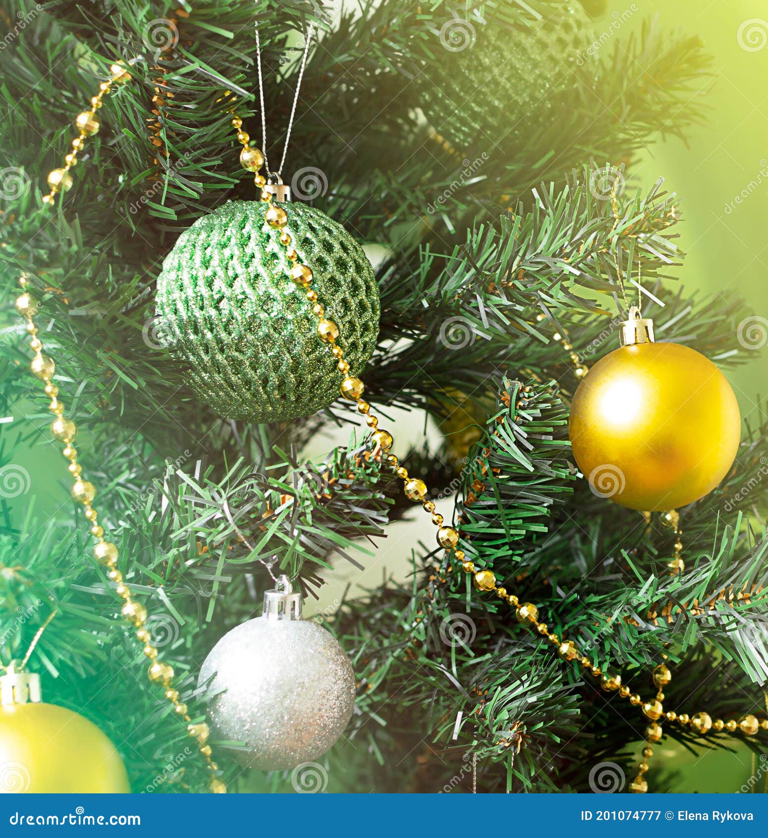 Decorating Christmas Tree with Balls and Golden Beads Stock Image