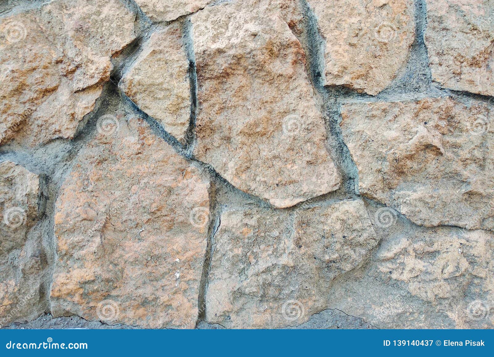 Decorative Beige Facing Stone on the Wall. the Texture of the Wall of the Old Stone Stock Image