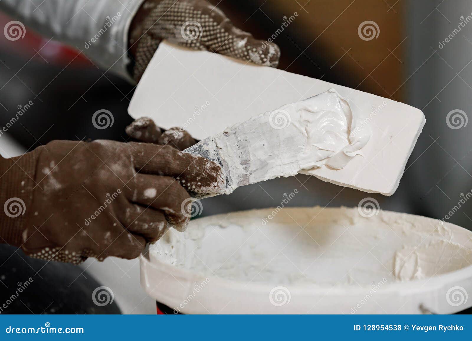Decorative Brick with Glue before Mounting on the Wall. Stock Photo