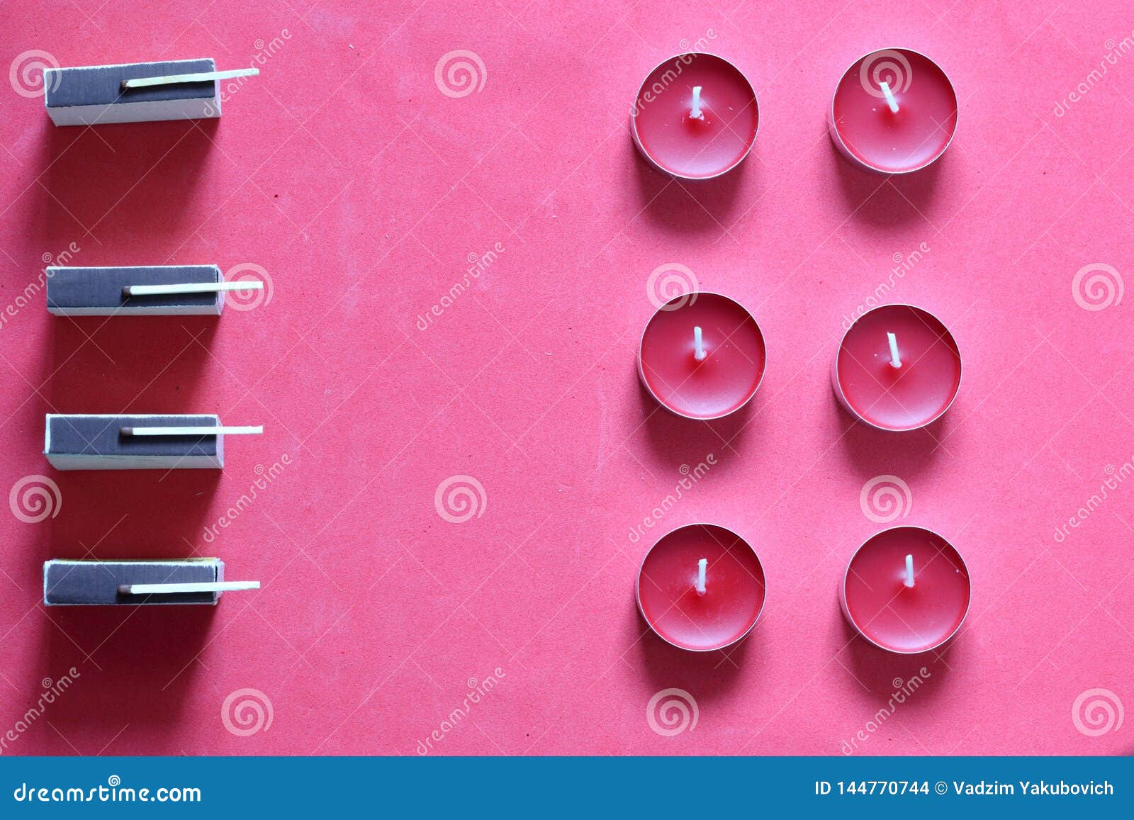 Decorative Candles, Matchboxes and Matches are Arranged in a Row. on a
