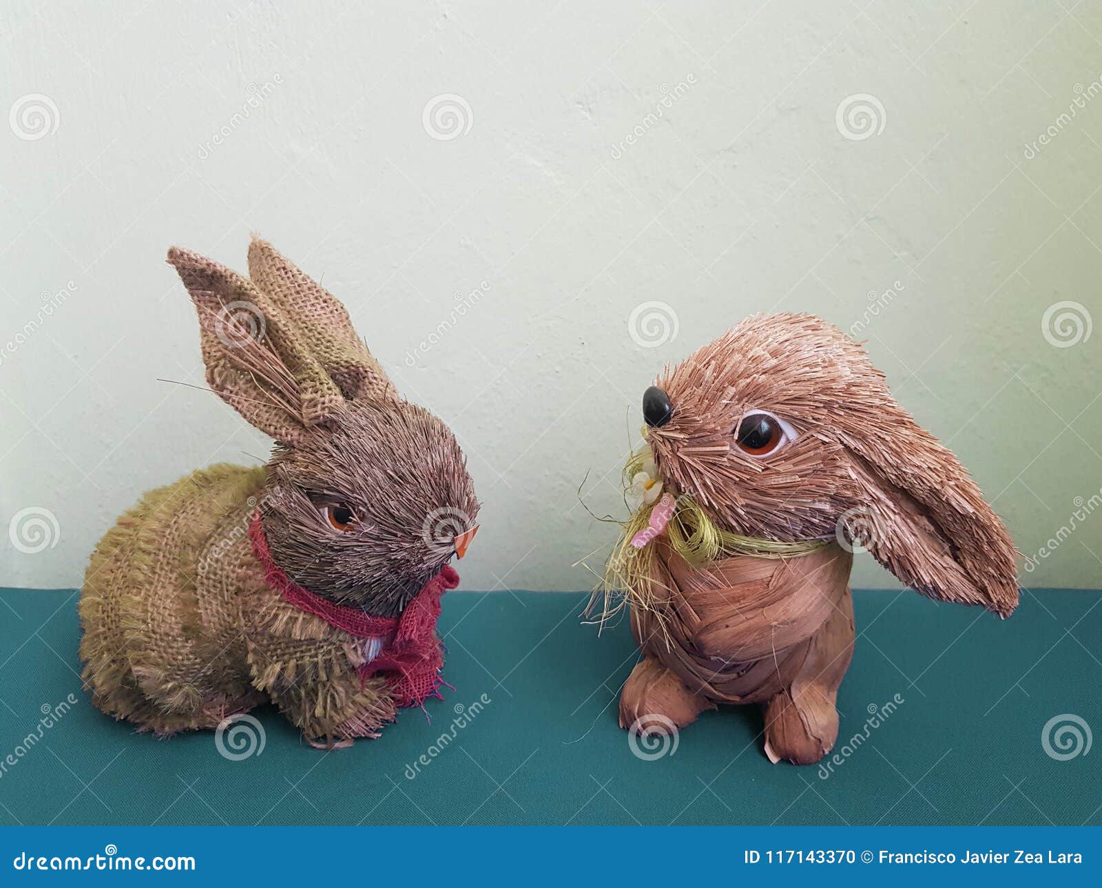 decorative figure of two rabbits with dry branches and recycled material