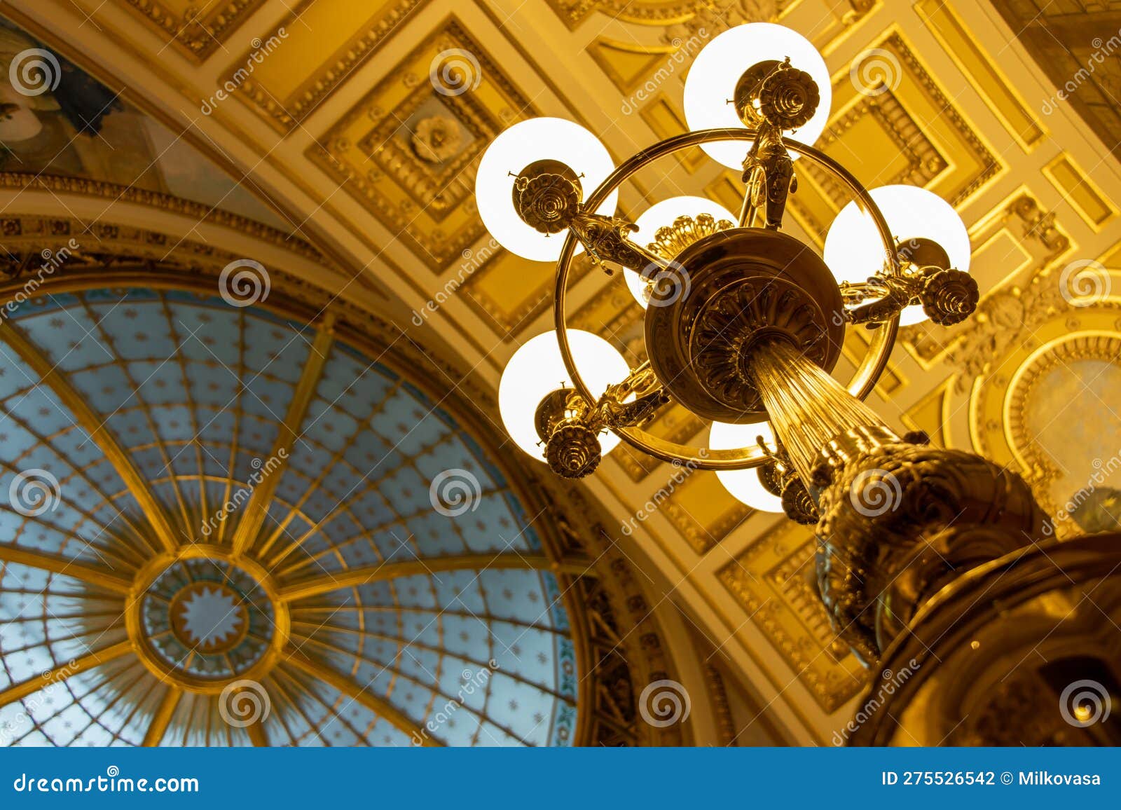 A Decorative Lantern Lighting Under a Decorative Ceiling with a Cupola