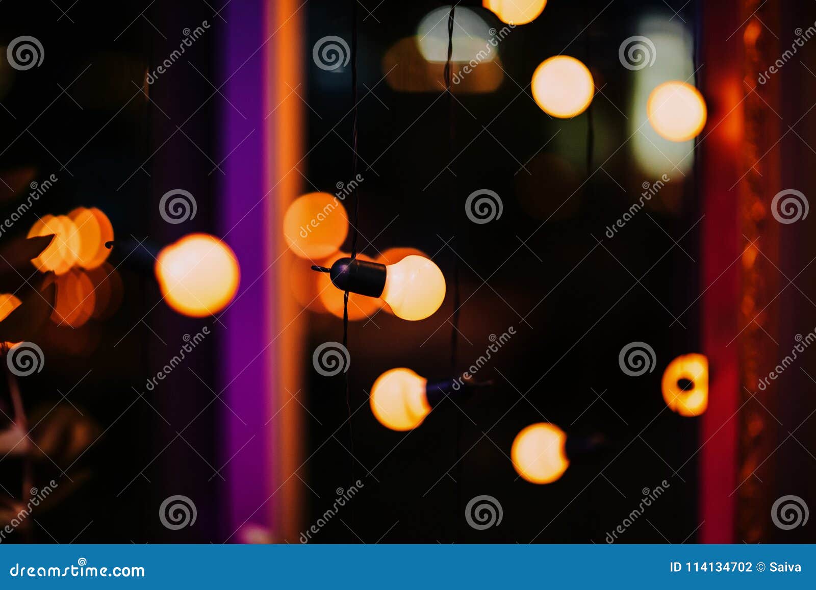 Decorative Outdoor Lights Hanging in the Garden at Night Stock Photo 