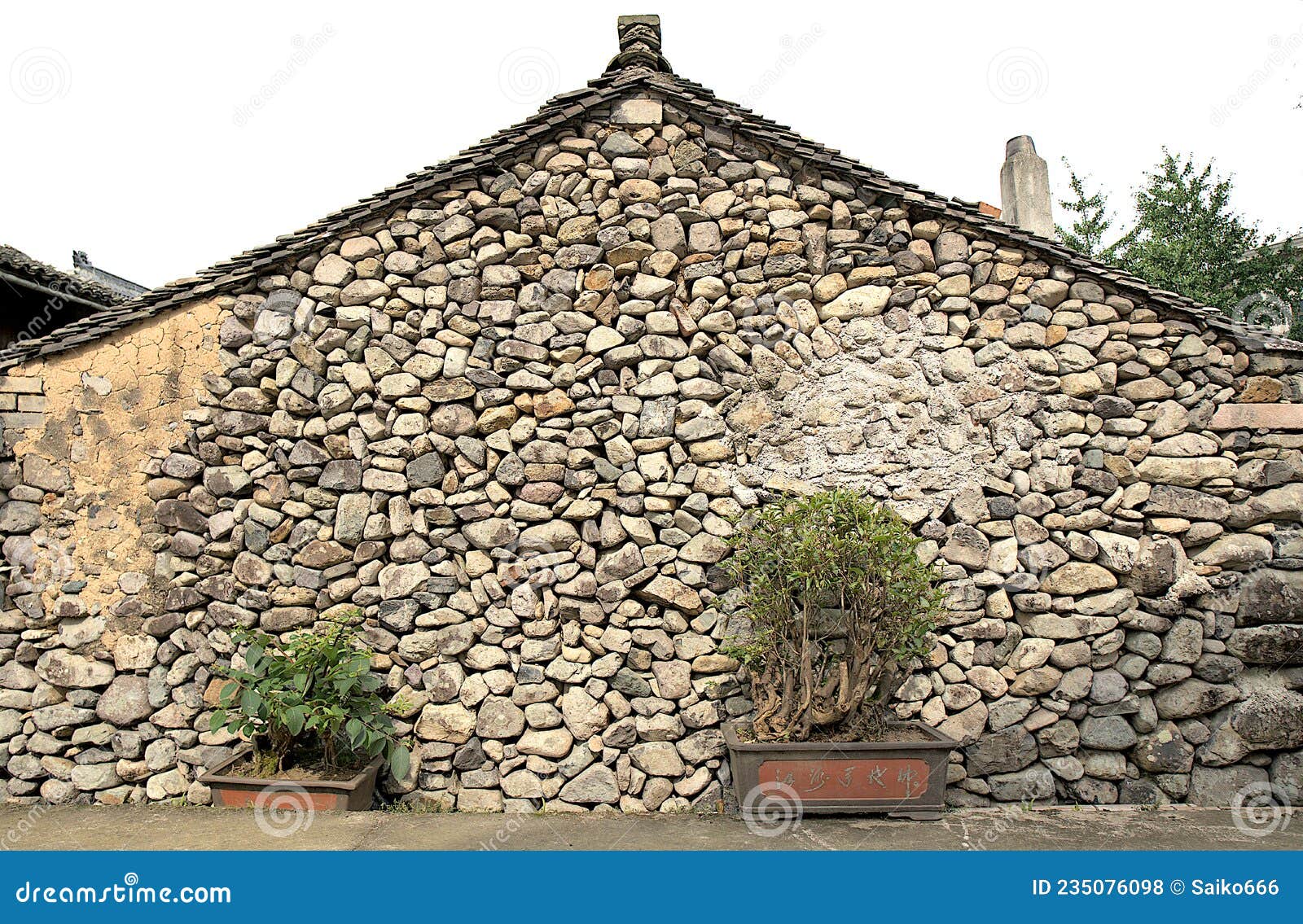 decorative stone wall of the old building located in gejia village.