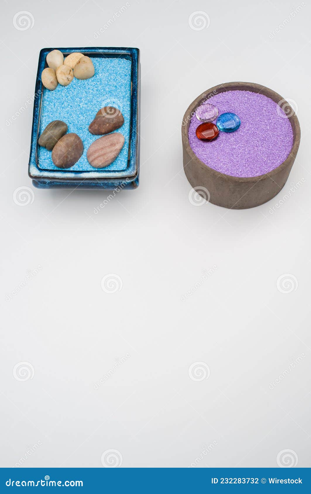 Decorative Vases with Colored Sand and Pebbles on a White Backgr Stock