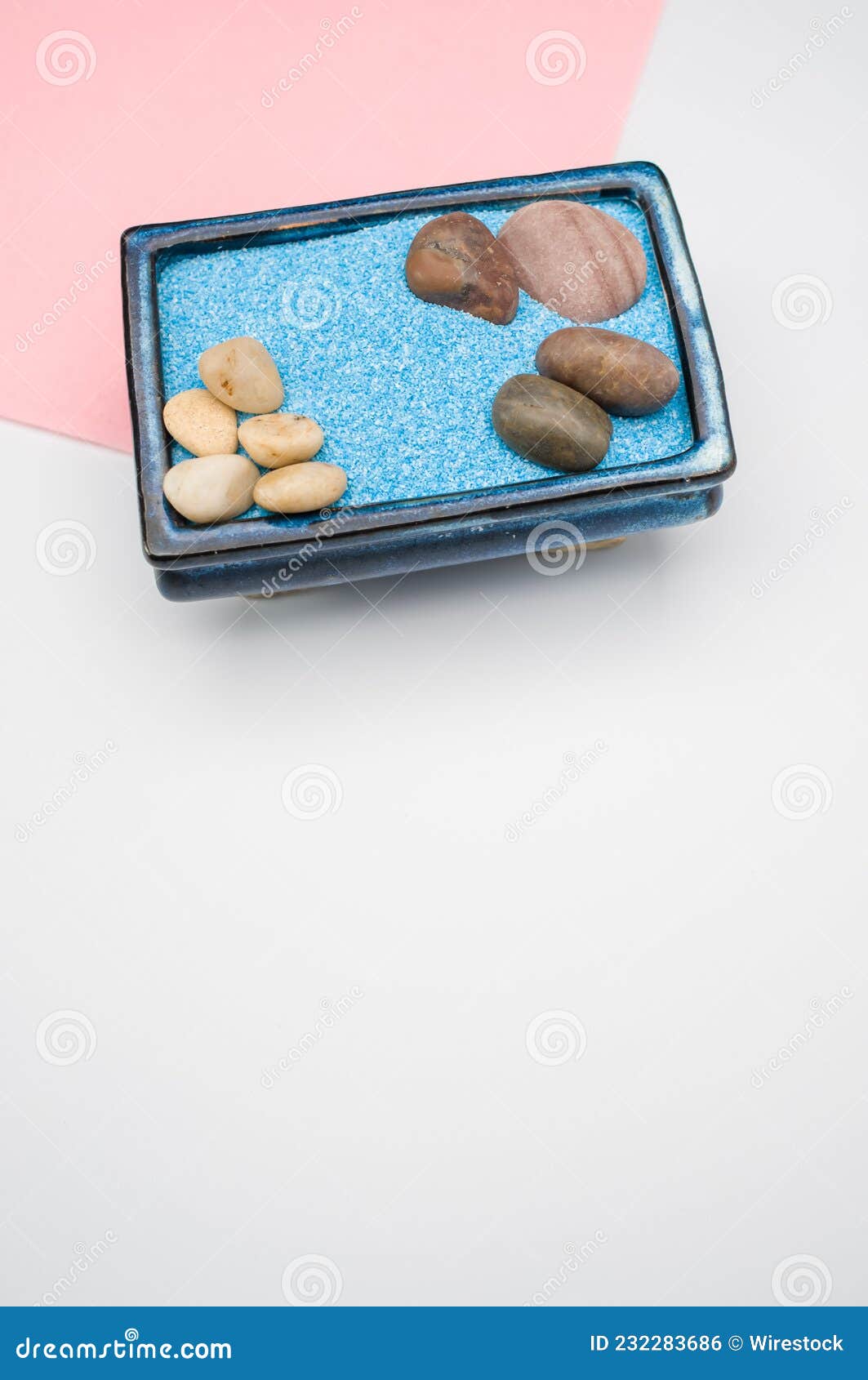 Decorative Vases with Colored Sand and Pebbles on a White Background