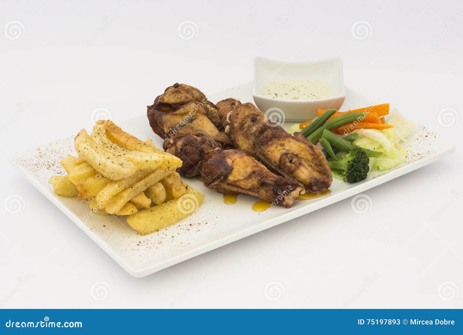 deep-fried chicken (chicharrÃÂ³n de pollo), fried chicken nuggets, french fries and vegetables with chili sauce