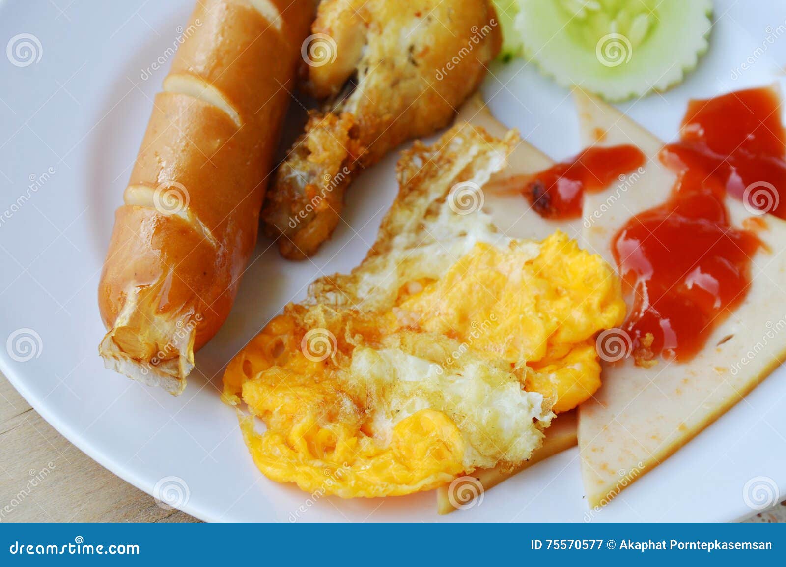 Deep Fried Egg and Sausage Dressing Tomato Sauce on Plate Stock Image