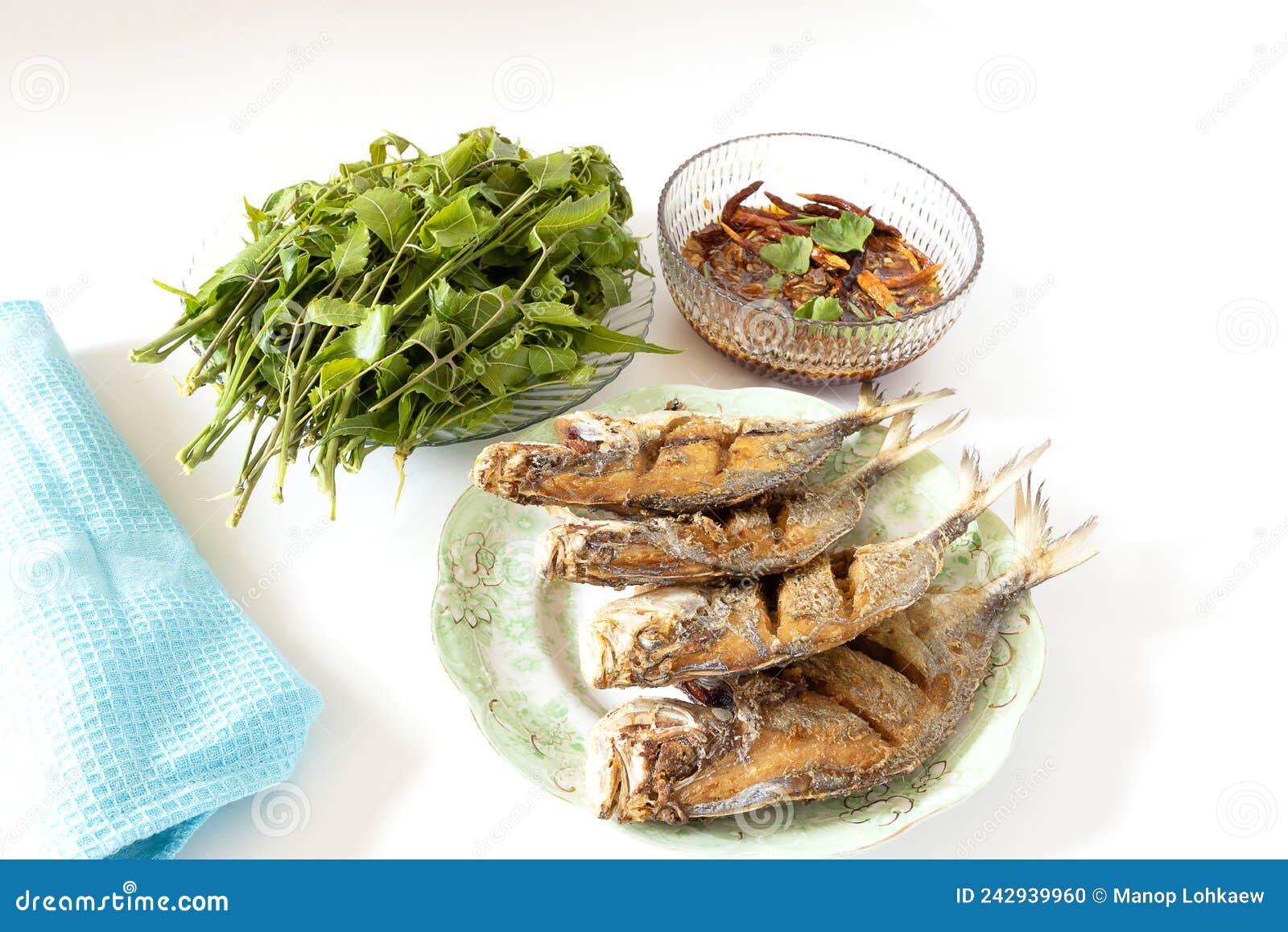 Deep Fried Fishes on Plate with Vegetable and Dipping Sauce on White