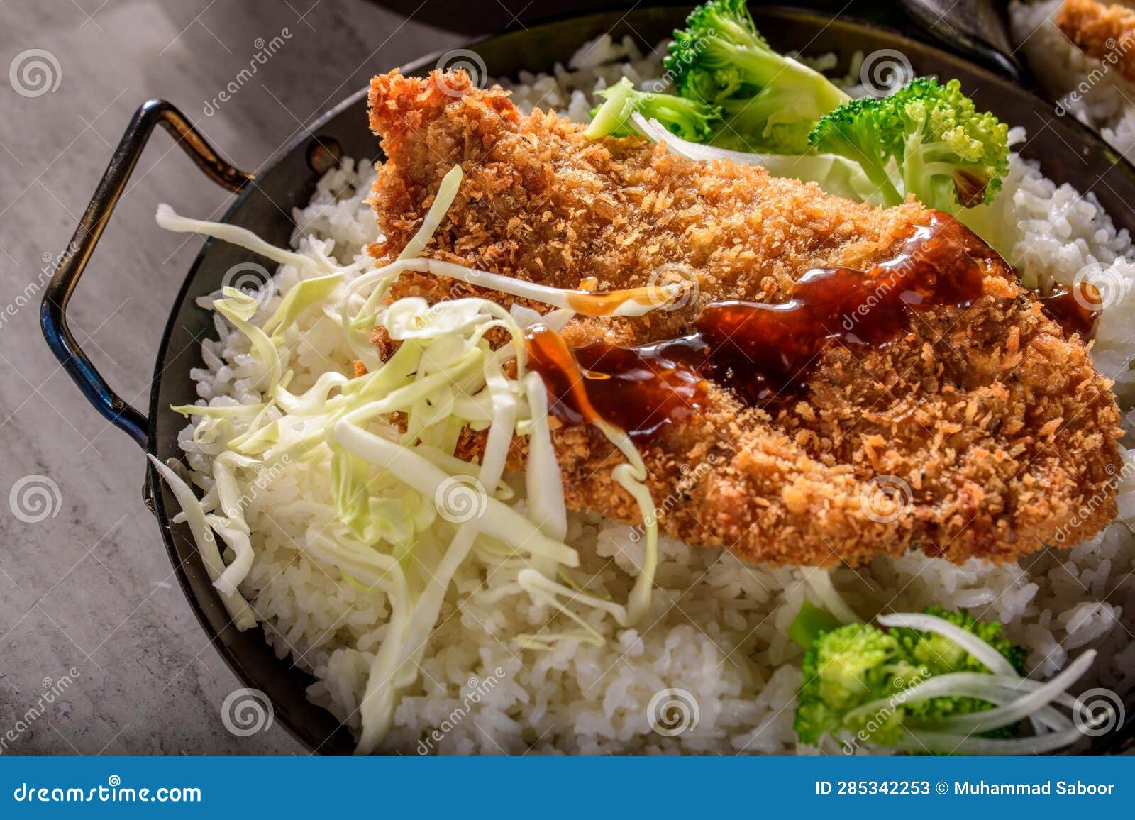 DeepFried Orange Chicken Served on a Bed of Steamed White Rice