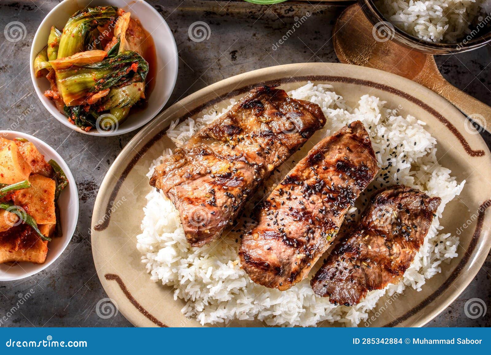DeepFried Orange Chicken Served on a Bed of Steamed White Rice