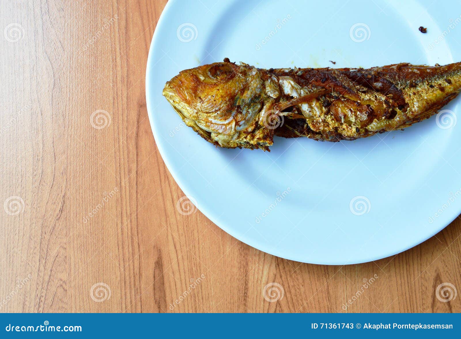 Deep Fried Red Snapper with Turmeric Powder on Plate Stock Image