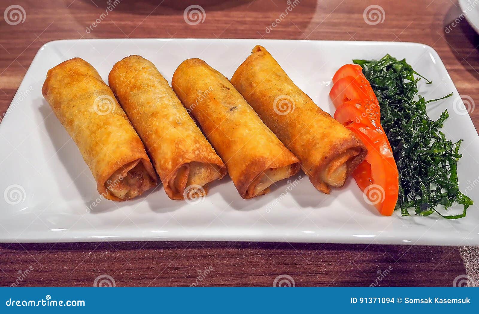 Deep Fried Spring Roll with Fresh Vegetable on Plate. Stock Photo