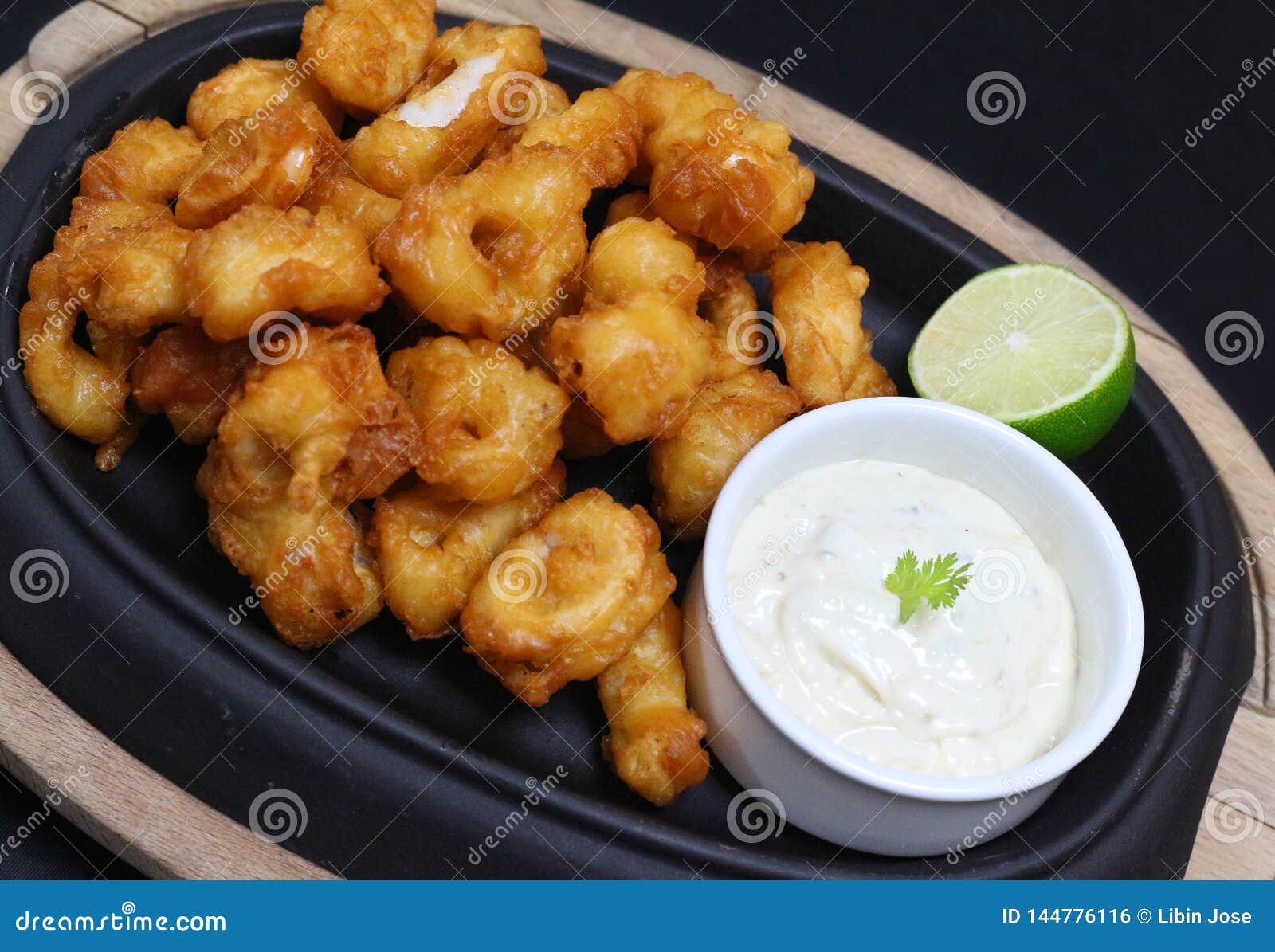 Deep Fried Tempura Calamari with Tartar Sauce and Lime Stock Photo
