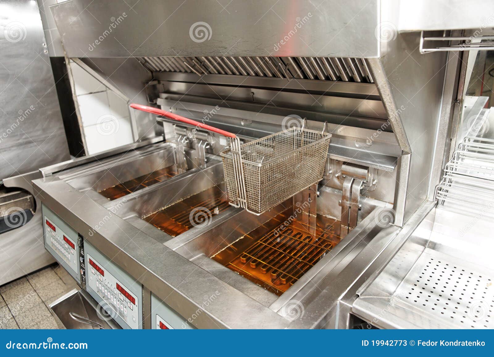 Deep Fryers With Boiling Oil On Kitchen Stock Photo - Download