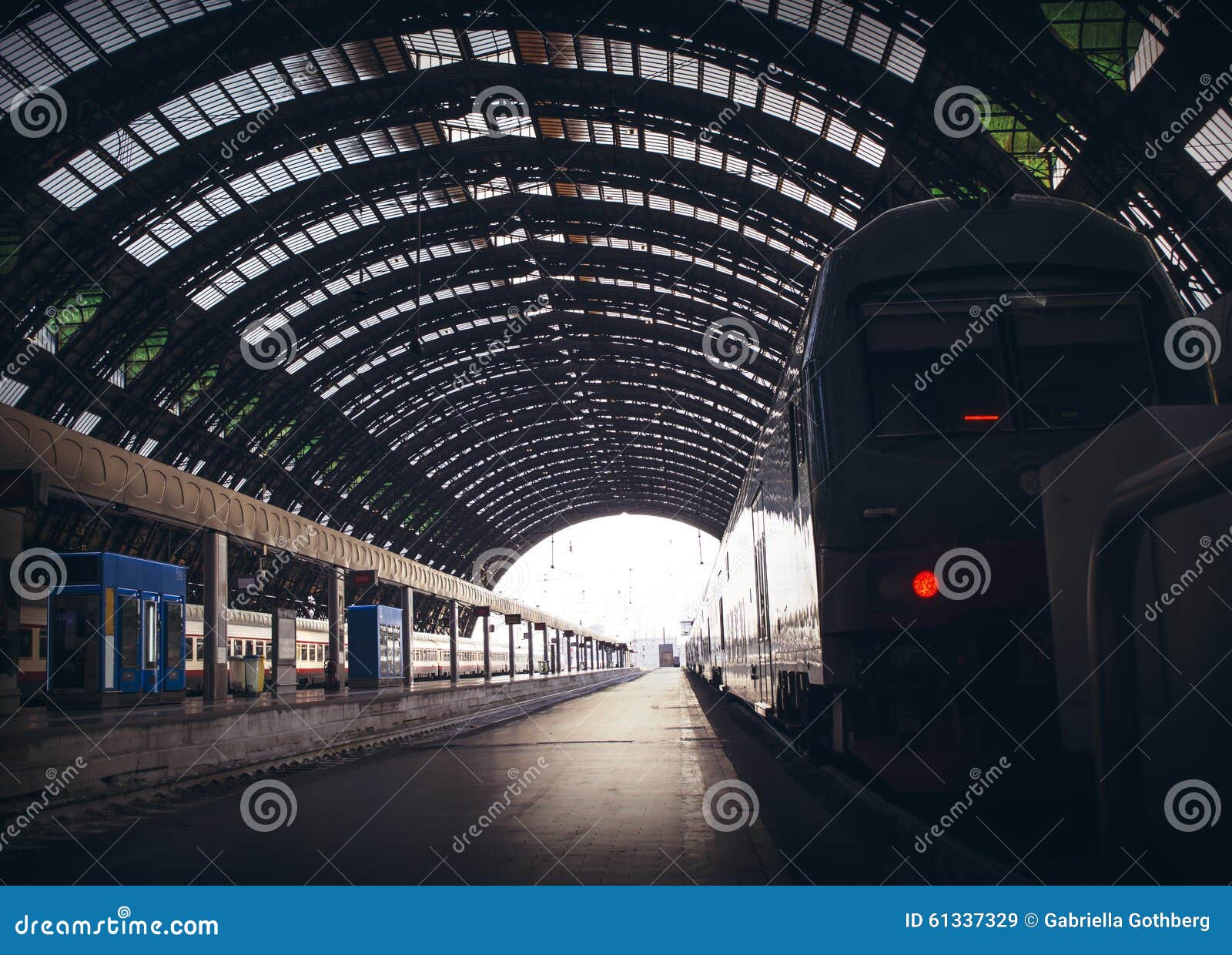 Deep Perspective of Rails and a Train at Milan Central Station. Stock