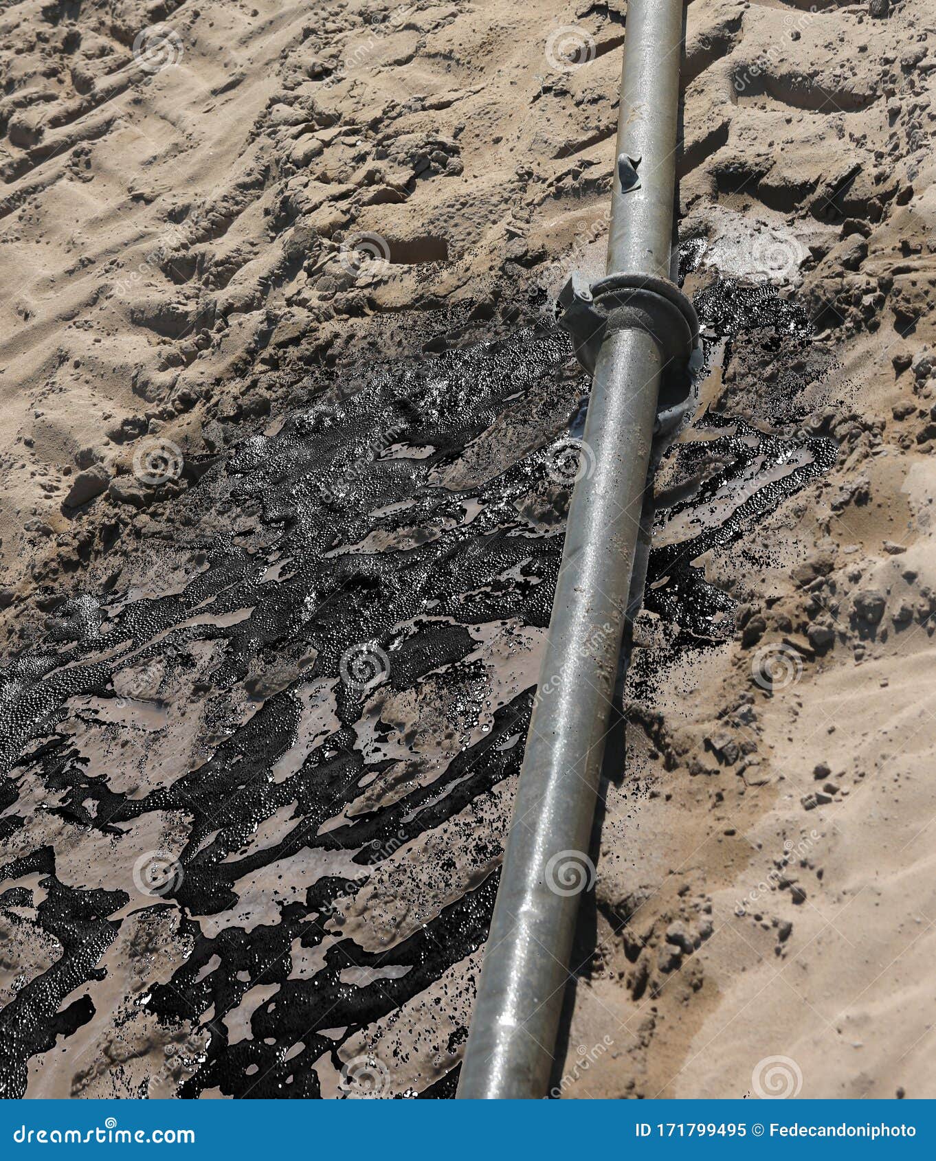 defective pipe leaks oil on a field