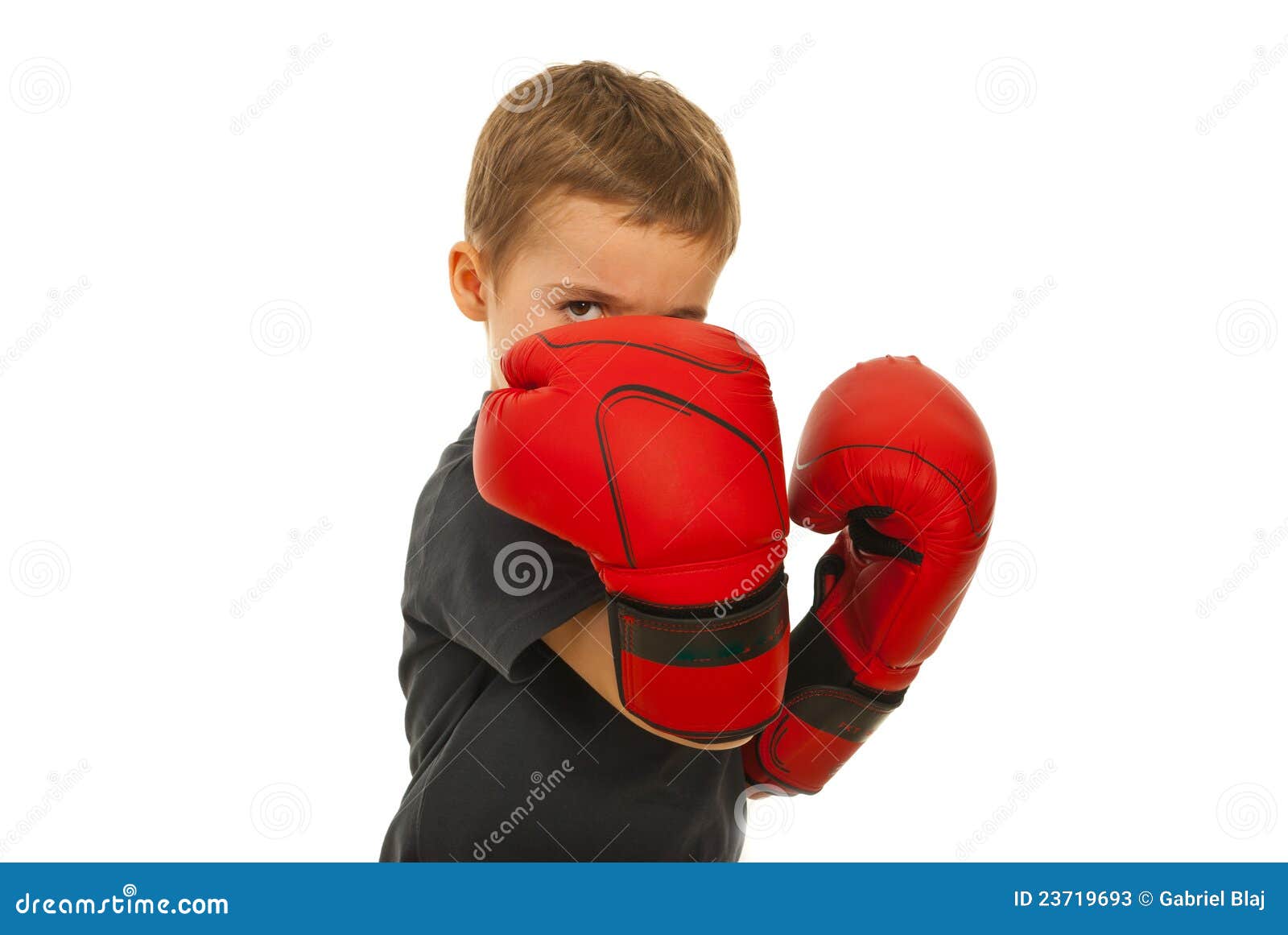 defending little boy with boxing gloves