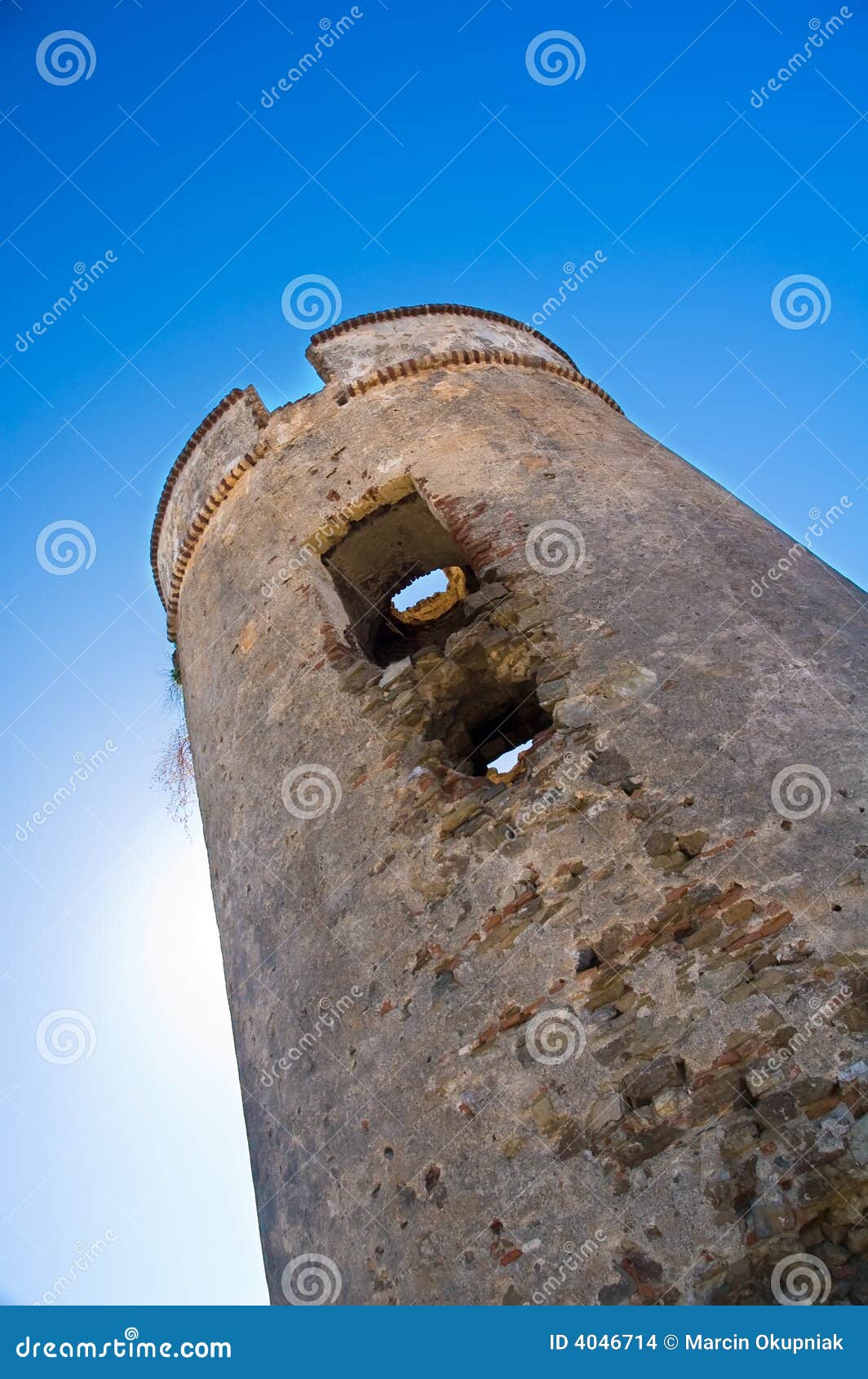 defensive tower with sun behind